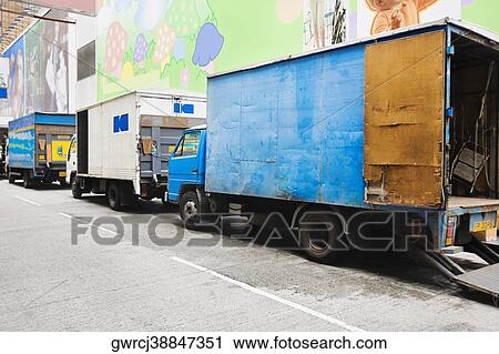 Trucks parked at the roadside, Hong Kong Island, Hong Kong, China View Large Photo Image Stock Image - Trucks parked at the roadside, Hong Kong Island, Hong Kong, China. Fotosearch