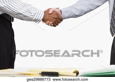 Two businessmen shaking hands View Large Photo Image Stock Image - Two businessmen shaking hands. Fotosearch
