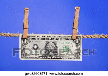 US one dollar bill hanging on a clothesline View Large Photo Image Stock Image - US one dollar bill hanging on a clothesline. Fotosearch