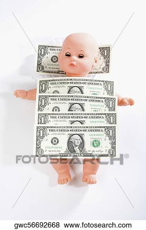Stock Photo - US one dollar bills on a doll. Fotosearch