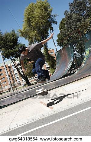 Picture - Young man skateboarding. Fotosearch