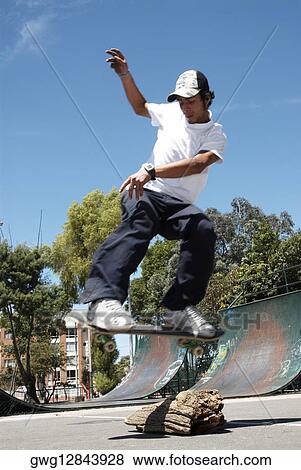 Young man skateboarding View Large Photo Image Stock Photo - Young man skateboarding. Fotosearch