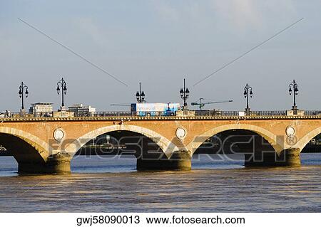 Arch bridge across a river, Pont De Pierre, Garonne River, Bordeaux, Aquitaine, France View Large Photo Image Stock Image - Arch bridge across a river, Pont De Pierre, Garonne River, Bordeaux, Aquitaine, France. Fotosearch