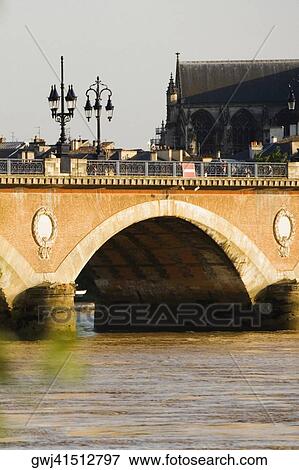 Arch bridge across a river, Pont De Pierre, St. Michel Basilica, Garonne River, Bordeaux, Aquitaine, France View Large Photo Image Stock Photo - Arch bridge across a river, Pont De Pierre, St. Michel Basilica, Garonne River, Bordeaux, Aquitaine, France. Fotosearch