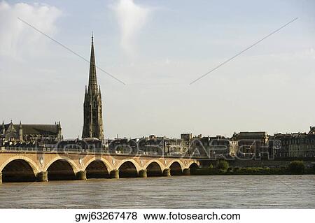Arch bridge across a river, Pont de Pierre, St. Michel Basilica, Garonne River, Bordeaux, Aquitaine, France View Large Photo Image Stock Photo - Arch bridge across a river, Pont de Pierre, St. Michel Basilica, Garonne River, Bordeaux, Aquitaine, France. Fotosearch