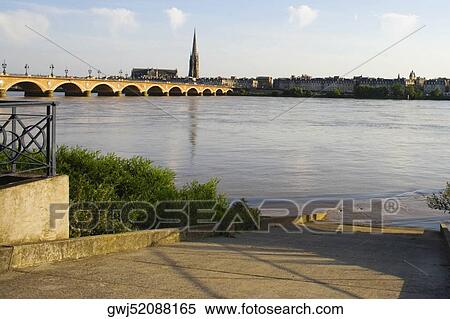 Arch bridge across a river, Pont De Pierre, St. Michel Basilica, Garonne River, Bordeaux, Aquitaine, France View Large Photo Image Stock Photography - Arch bridge across a river, Pont De Pierre, St. Michel Basilica, Garonne River, Bordeaux, Aquitaine, France. Fotosearch