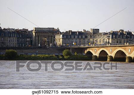 Arch bridge across a river, Pont De Pierre, Porte De Bourgogne, Garonne River, Bordeaux, Aquitaine, France View Large Photo Image Stock Photography - Arch bridge across a river, Pont De Pierre, Porte De Bourgogne, Garonne River, Bordeaux, Aquitaine, France. Fotosearch