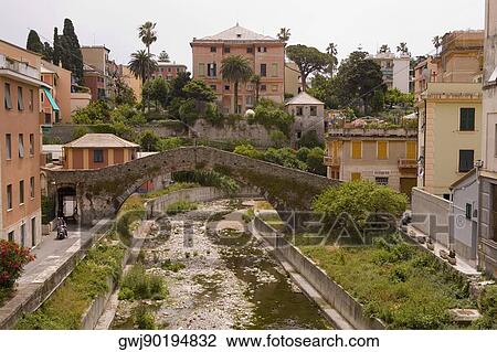 Arch bridge near buildings, Genoa Province, Liguria, Italy View Large Photo Image Stock Image - Arch bridge near buildings, Genoa Province, Liguria, Italy. Fotosearch