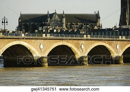 Arch bridge over a river, Pont De Pierre, St. Michel Basilica, Garonne River, Bordeaux, Aquitaine, France View Large Photo Image Stock Image - Arch bridge over a river, Pont De Pierre, St. Michel Basilica, Garonne River, Bordeaux, Aquitaine, France. Fotosearch