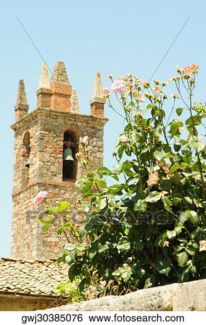 Bell tower of a church, Romanesque Church, Piazza Roma, Monteriggioni, Siena Province, Tuscany, Italy View Large Photo Image Stock Photograph - Bell tower of a church, Romanesque Church, Piazza Roma, Monteriggioni, Siena Province, Tuscany, Italy. Fotosearch
