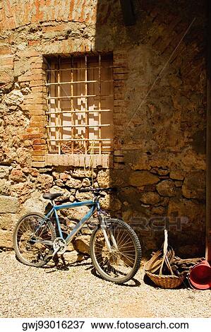Bicycle in front of a wall, Monteriggioni, Siena Province, Tuscany, Italy View Large Photo Image Stock Photo - Bicycle in front of a wall, Monteriggioni, Siena Province, Tuscany, Italy. Fotosearch