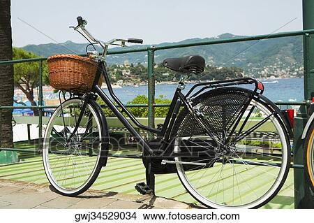 Bicycle leaning against a railing, Italian Riviera, Santa Margherita Ligure, Genoa, Liguria, Italy View Large Photo Image Picture - Bicycle leaning against a railing, Italian Riviera, Santa Margherita Ligure, Genoa, Liguria, Italy. Fotosearch
