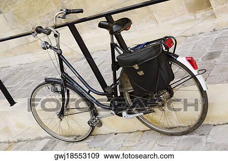 Bicycle leaning against a railing, Hotel De Ville, Bordeaux, Aquitaine, France View Large Photo Image Stock Photo - Bicycle leaning against a railing, Hotel De Ville, Bordeaux, Aquitaine, France. Fotosearch