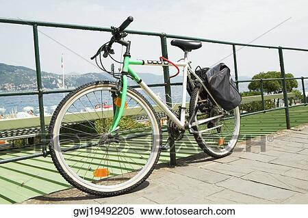 Bicycle leaning against a railing, Italian Riviera, Santa Margherita Ligure, Genoa, Liguria, Italy View Large Photo Image Stock Photography - Bicycle leaning against a railing, Italian Riviera, Santa Margherita Ligure, Genoa, Liguria, Italy. Fotosearch