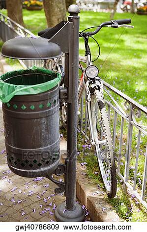 Bicycle parked near a garbage bin, Piazza Tasso, Sorrento, Naples Province, Campania, Italy View Large Photo Image Stock Photo - Bicycle parked near a garbage bin, Piazza Tasso, Sorrento, Naples Province, Campania, Italy. Fotosearch