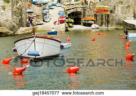 Boat moored at a harbor, Italian Riviera, Genoa, Liguria, Italy View Large Photo Image Stock Photo - Boat moored at a harbor, Italian Riviera, Genoa, Liguria, Italy. Fotosearch