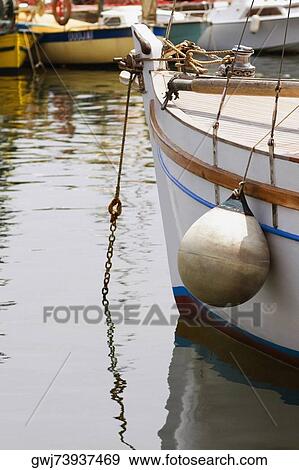 Boat moored at a harbor, Vieux Port, Cote d'Azur, Cannes, Provence-Alpes-Cote D'Azur, France View Large Photo Image Stock Photo - Boat moored at a harbor, Vieux Port, Cote d'Azur, Cannes, Provence-Alpes-Cote D'Azur, France. Fotosearch