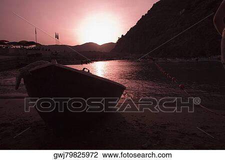 Boat on the beach at dusk, Italian Riviera, Cinque Terre National Park, Il Porticciolo, Vernazza, La Spezia, Liguria, Italy View Large Photo Image Stock Image - Boat on the beach at dusk, Italian Riviera, Cinque Terre National Park, Il Porticciolo, Vernazza, La Spezia, Liguria, Italy. Fotosearch