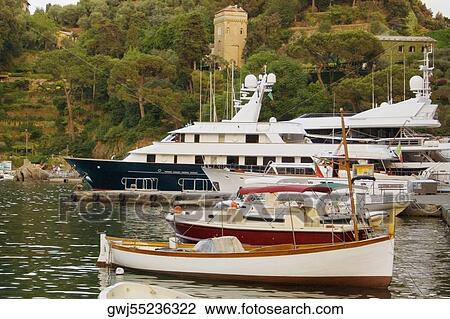 Boats at a harbor, Italian Riviera, Portofino, Genoa, Liguria, Italy View Large Photo Image Stock Image - Boats at a harbor, Italian Riviera, Portofino, Genoa, Liguria, Italy. Fotosearch