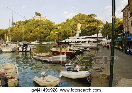 Boats at a harbor, Italian Riviera, Portofino, Genoa, Liguria, Italy View Large Photo Image Stock Photo - Boats at a harbor, Italian Riviera, Portofino, Genoa, Liguria, Italy. Fotosearch