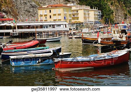 Boats at a harbor, Marina Grande, Capri, Sorrento, Sorrentine Peninsula, Naples Province, Campania, Italy View Large Photo Image Stock Photo - Boats at a harbor, Marina Grande, Capri, Sorrento, Sorrentine Peninsula, Naples Province, Campania, Italy. Fotosearch