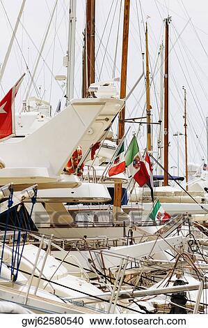 Boats at a harbor, Vieux Port, Cote d'Azur, Cannes, Provence-Alpes-Cote D'Azur, France View Large Photo Image Stock Image - Boats at a harbor, Vieux Port, Cote d'Azur, Cannes, Provence-Alpes-Cote D'Azur, France. Fotosearch