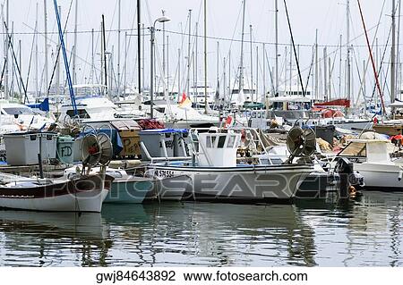 Boats at a harbor, Vieux Port, Cote d'Azur, Cannes, Provence-Alpes-Cote D'Azur, France View Large Photo Image Stock Image - Boats at a harbor, Vieux Port, Cote d'Azur, Cannes, Provence-Alpes-Cote D'Azur, France. Fotosearch