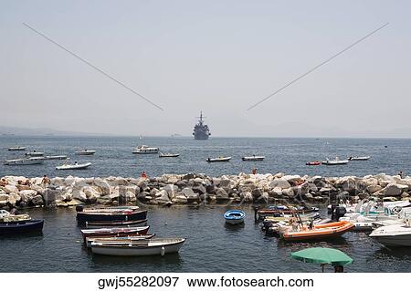 Boats docked at a harbor, Bay of Naples, Naples, Naples Province, Campania, Italy View Large Photo Image Stock Photo - Boats docked at a harbor, Bay of Naples, Naples, Naples Province, Campania, Italy. Fotosearch
