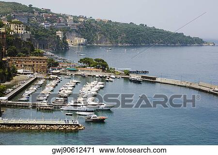 Boats docked at a harbor, Marina Grande, Capri, Sorrento, Sorrentine Peninsula, Naples Province, Campania, Italy View Large Photo Image Stock Image - Boats docked at a harbor, Marina Grande, Capri, Sorrento, Sorrentine Peninsula, Naples Province, Campania, Italy. Fotosearch