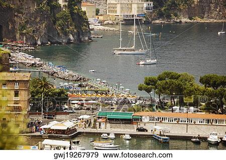Stock Photo - Boats docked at a harbor, Marina Grande, Capri, Sorrento, Sorrentine Peninsula, Naples Province, Campania, Italy. Fotosearch