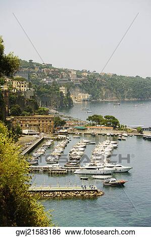 Boats docked at a harbor, Marina Grande, Capri, Sorrento, Sorrentine Peninsula, Naples Province, Campania, Italy View Large Photo Image Stock Photograph - Boats docked at a harbor, Marina Grande, Capri, Sorrento, Sorrentine Peninsula, Naples Province, Campania, Italy. Fotosearch