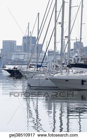 Boats docked at a harbor, Porto Antico, Genoa, Italy View Large Photo Image Stock Photo - Boats docked at a harbor, Porto Antico, Genoa, Italy. Fotosearch