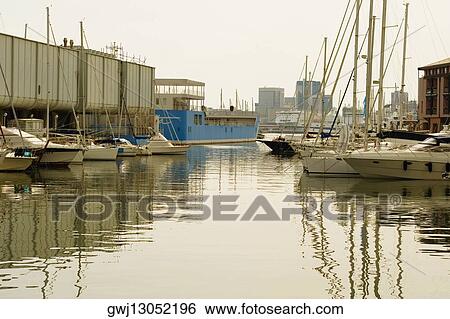 Boats docked at a harbor, Porto Antico, Genoa, Italy View Large Photo Image Stock Photograph - Boats docked at a harbor, Porto Antico, Genoa, Italy. Fotosearch