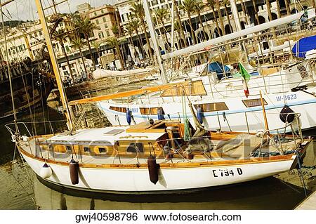 Boats docked at a harbor, Porto Antico, Genoa, Italy View Large Photo Image Stock Photograph - Boats docked at a harbor, Porto Antico, Genoa, Italy. Fotosearch