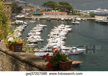 Boats docked at a harbor, Sorrento, Sorrentine Peninsula, Naples Province, Campania, Italy View Large Photo Image Stock Photo - Boats docked at a harbor, Sorrento, Sorrentine Peninsula, Naples Province, Campania, Italy. Fotosearch