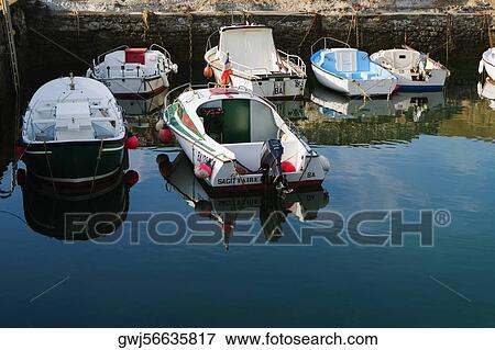 Boats docked at a port, Port Des Pecheurs, Biarritz, France View Large Photo Image Stock Photo - Boats docked at a port, Port Des Pecheurs, Biarritz, France. Fotosearch