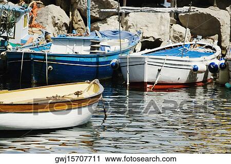 Boats docked at harbor, Marina Grande, Capri, Sorrento, Naples Province, Campania, Italy View Large Photo Image Stock Image - Boats docked at harbor, Marina Grande, Capri, Sorrento, Naples Province, Campania, Italy. Fotosearch