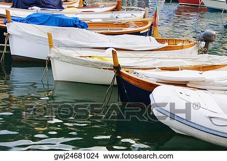 Boats moored at a harbor, Italian Riviera, Portofino, Genoa, Liguria, Italy View Large Photo Image Picture - Boats moored at a harbor, Italian Riviera, Portofino, Genoa, Liguria, Italy. Fotosearch