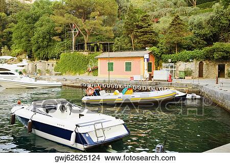 Boats moored at a harbor, Italian Riviera, Portofino, Genoa, Liguria, Italy View Large Photo Image Picture - Boats moored at a harbor, Italian Riviera, Portofino, Genoa, Liguria, Italy. Fotosearch