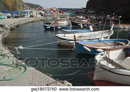 Boats moored at a harbor, Italian Riviera, Cinque Terre National Park, Mar Ligure, RioMaggiore, Cinque Terre, Vernazza, La Spezia, Liguria, Italy View Large Photo Image Stock Image - Boats moored at a harbor, Italian Riviera, Cinque Terre National Park, Mar Ligure, RioMaggiore, Cinque Terre, Vernazza, La Spezia, Liguria, Italy. Fotosearch