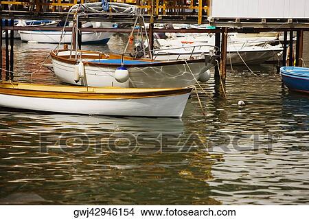 Boats moored at a harbor, Marina Grande, Capri, Sorrento, Sorrentine Peninsula, Naples Province, Campania, Italy View Large Photo Image Picture - Boats moored at a harbor, Marina Grande, Capri, Sorrento, Sorrentine Peninsula, Naples Province, Campania, Italy. Fotosearch