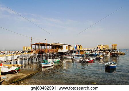 Boats moored at a harbor, Marina Grande, Capri, Sorrento, Sorrentine Peninsula, Naples Province, Campania, Italy View Large Photo Image Stock Image - Boats moored at a harbor, Marina Grande, Capri, Sorrento, Sorrentine Peninsula, Naples Province, Campania, Italy. Fotosearch