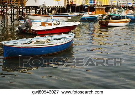 Boats moored at a harbor, Marina Grande, Capri, Sorrento, Sorrentine Peninsula, Naples Province, Campania, Italy View Large Photo Image Stock Photo - Boats moored at a harbor, Marina Grande, Capri, Sorrento, Sorrentine Peninsula, Naples Province, Campania, Italy. Fotosearch