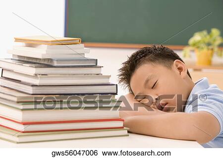 Stock Photograph - Boy napping in a classroom. Fotosearch