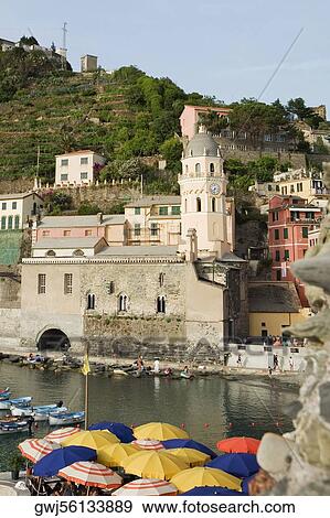 Building at a riverside, Italian Riviera, Cinque Terre National Park, Piazza Marconi, Il Porticciolo, Vernazza, La Spezia, Liguria, Italy View Large Photo Image Stock Photo - Building at a riverside, Italian Riviera, Cinque Terre National Park, Piazza Marconi, Il Porticciolo, Vernazza, La Spezia, Liguria, Italy. Fotosearch