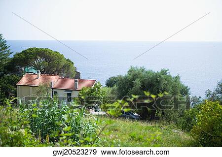 Building at the seaside, Italian Riviera, Mar Ligure, Genoa, Liguria, Italy View Large Photo Image Stock Photo - Building at the seaside, Italian Riviera, Mar Ligure, Genoa, Liguria, Italy. Fotosearch
