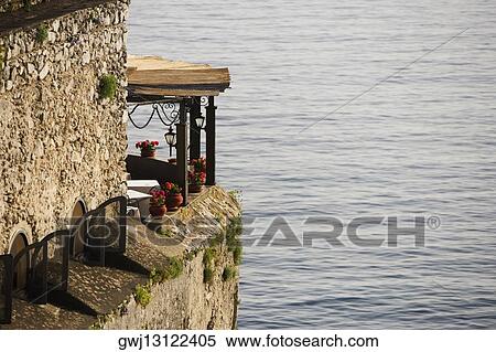 Building at the seaside, Torre Normanna, Costiera Amalfitana, Salerno, Campania, Italy View Large Photo Image Stock Photography - Building at the seaside, Torre Normanna, Costiera Amalfitana, Salerno, Campania, Italy. Fotosearch
