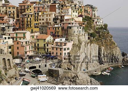 Buildings in a town, Italian Riviera, Cinque Terre, Manarola, La Spezia, Liguria, Italy View Large Photo Image Stock Photo - Buildings in a town, Italian Riviera, Cinque Terre, Manarola, La Spezia, Liguria, Italy. Fotosearch