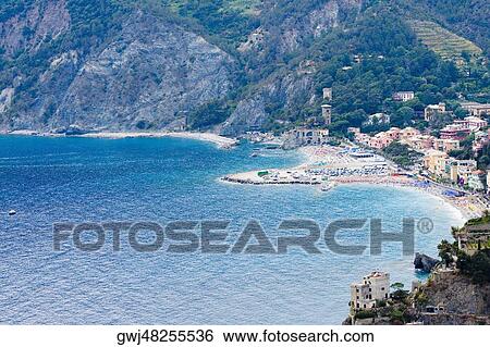 Stock Photograph - Buildings on the coast, Ligurian Sea, Italian Riviera, Cinque Terre, La Spezia, Liguria, Italy. Fotosearch
