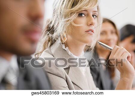 Business executives at a meeting in a board room View Large Photo Image Stock Photo - Business executives at a meeting in a board room. Fotosearch